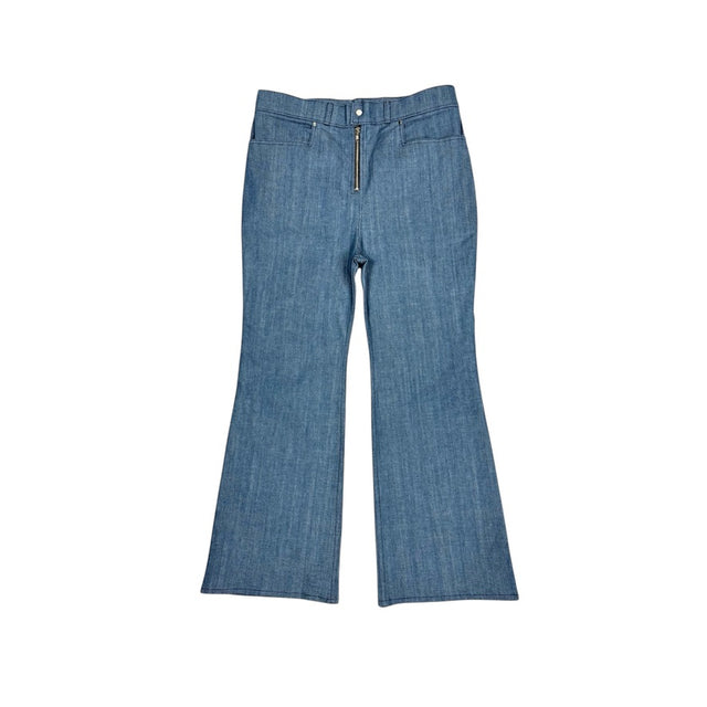 Front view of the LOVANT blue UNIFORM flared denim, laid flat, showing the exposed silver zip fly and flared leg.