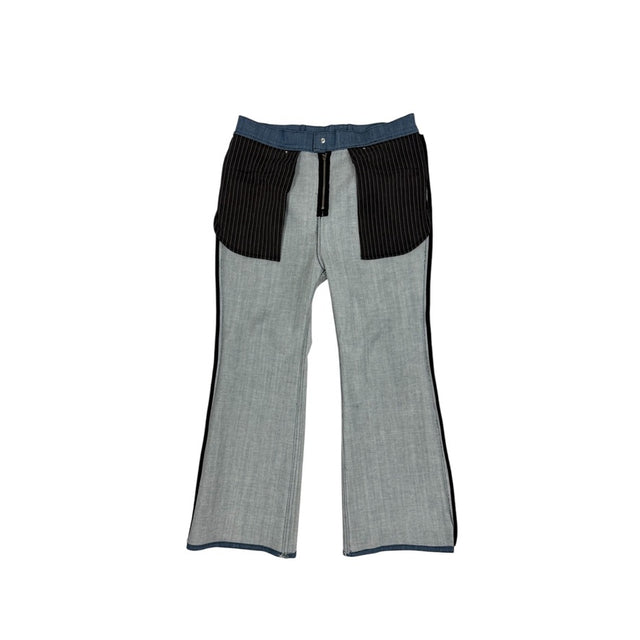 LOVANT blue UNIFORM flared denim turned inside out, showing the black pinstripe pocket bags and black bound side seams.