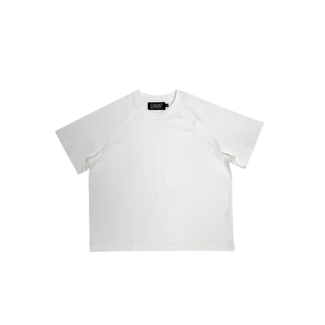 Front view of the LOVANT white raglan UNIFORM tee, laid flat, showing the clean front, crew neck and raglan sleeves.