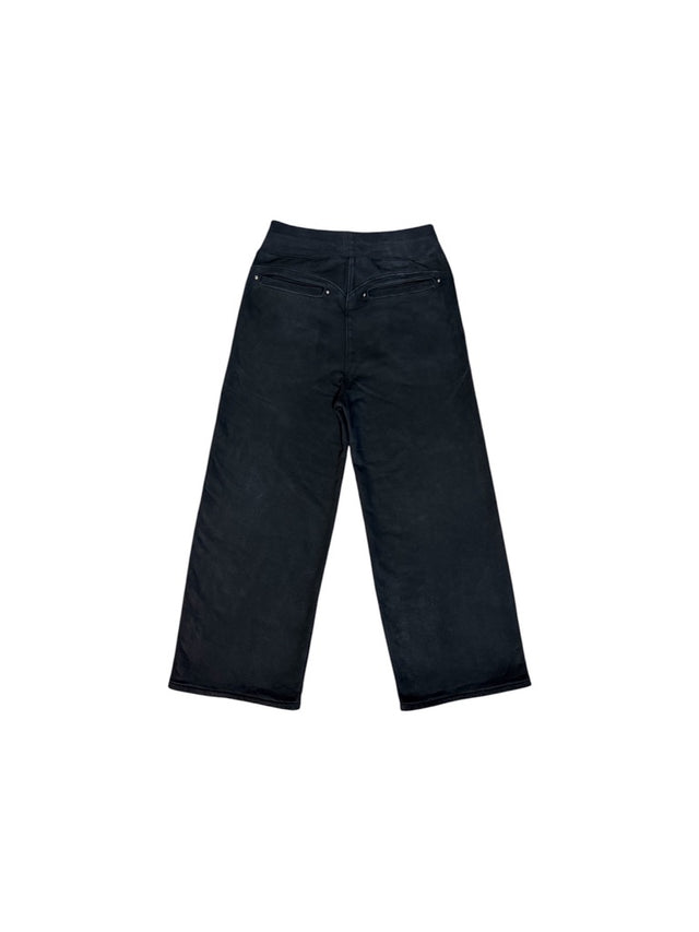 Back view of the LOVANT black sweats, laid flat, showing the curved back yoke and riveted welt pockets.
