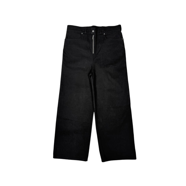 Front view of the LOVANT black UNIFORM wide leg denim, laid flat, showing the exposed silver zip fly and wide straight leg.