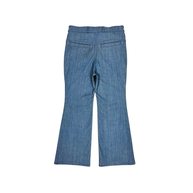 Back view of the LOVANT blue UNIFORM flared denim, laid flat, showing the riveted back pockets and flared leg.